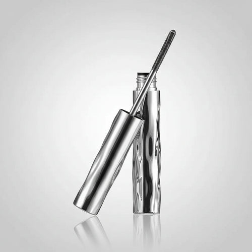 Eyelash extension tool with close-up images of an eye wearing false eyelashes.